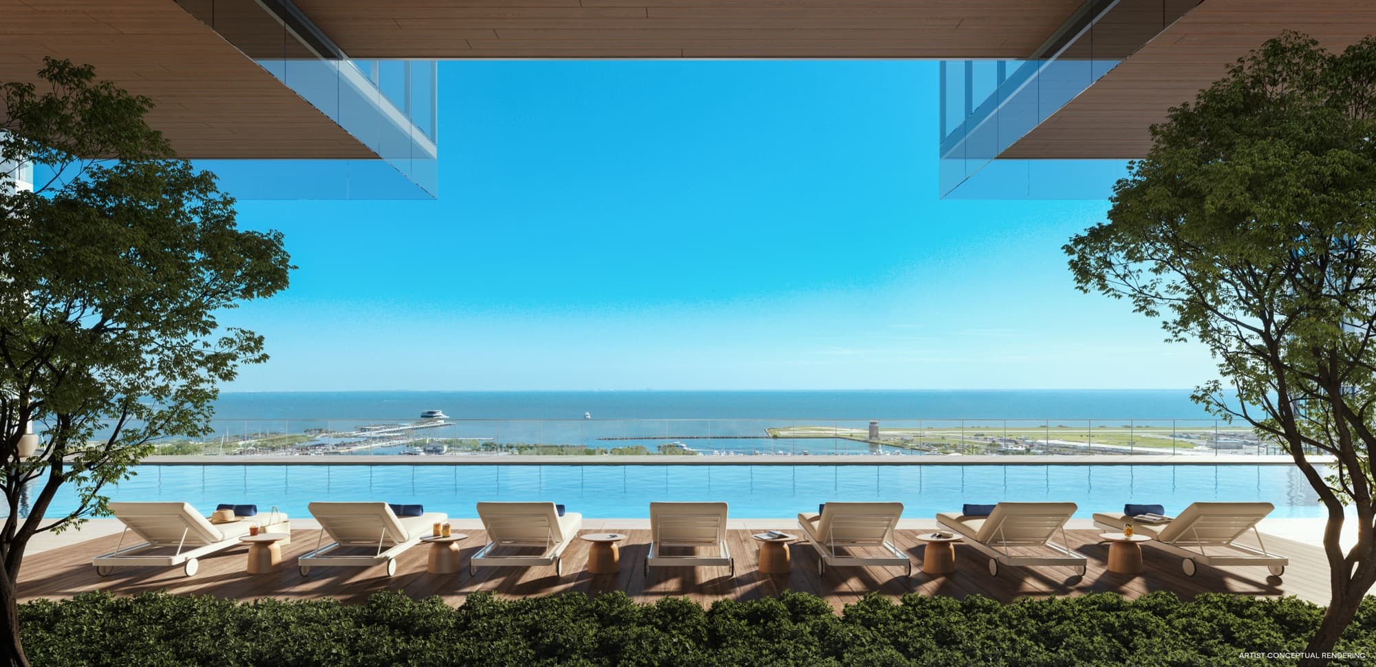 Resort-style pool deck with cabanas and bay views